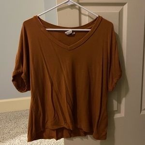 burnt orange v neck shirt